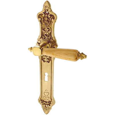 Zimmertürbeschlag patiniert aus Messing matt gold geschwungene Form